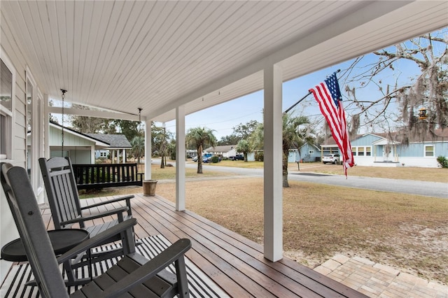 208 Bishop Cir, Saint Marys, GA 31558 - wooden terrace featuring covered porch and a lawn