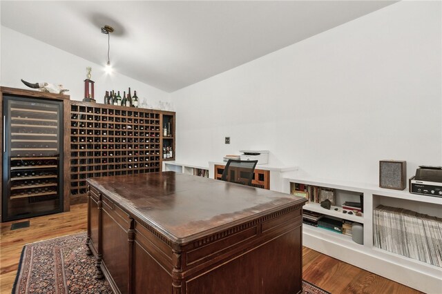 208 Bishop Cir, Saint Marys, GA 31558 - wine area featuring wine cooler, lofted ceiling, and light wood-type flooring