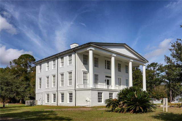 208 Bishop Cir, Saint Marys, GA 31558 - view of side of property with a chimney and a yard