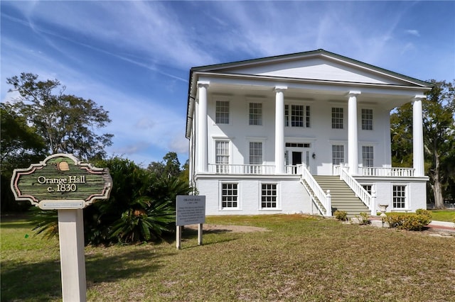 208 Bishop Cir, Saint Marys, GA 31558 - neoclassical / greek revival house with stairs, covered porch, and a front yard