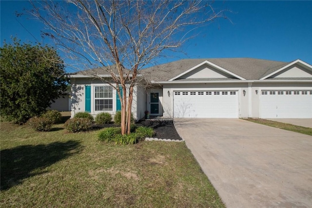 single story home with a garage, driveway, a front lawn, and stucco siding