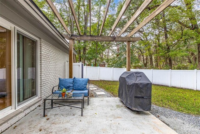 view of patio / terrace with a pergola and area for grilling