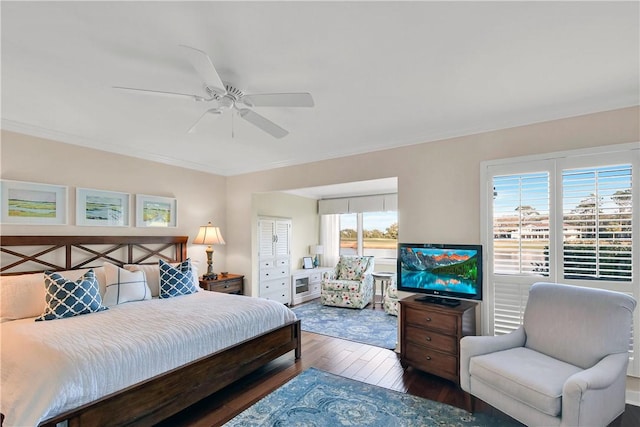 bedroom featuring ceiling fan, ornamental molding, and hardwood / wood-style flooring