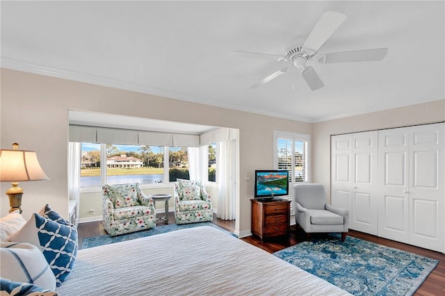 bedroom with wood finished floors and baseboards