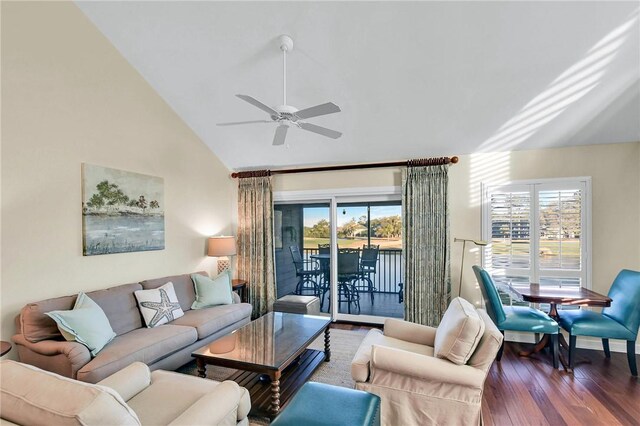 living area featuring high vaulted ceiling, ceiling fan, and wood finished floors