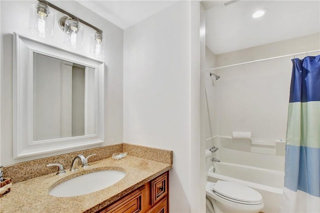 full bathroom featuring vanity, shower / bathtub combination with curtain, and toilet