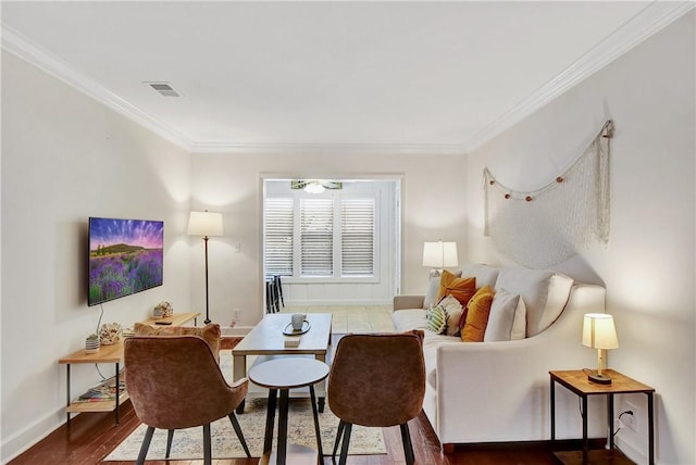 living room with crown molding and dark wood-type flooring