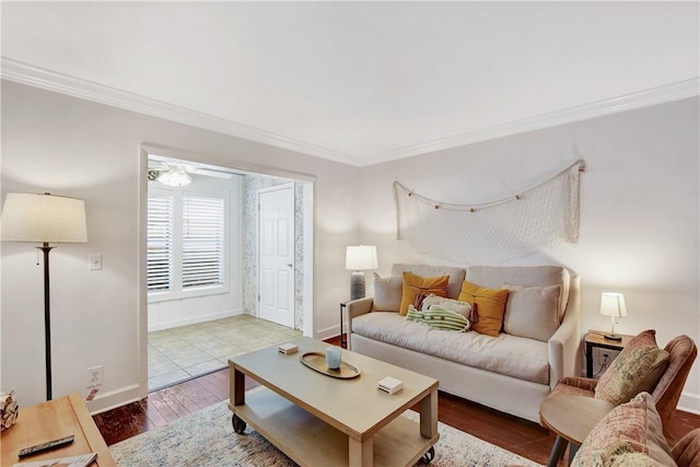 living room featuring hardwood / wood-style floors, ceiling fan, and ornamental molding