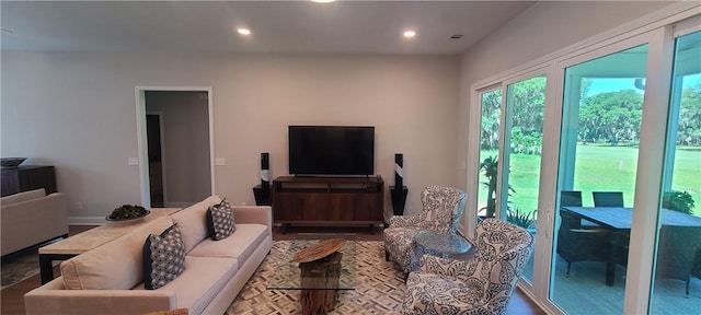 living room featuring visible vents and recessed lighting