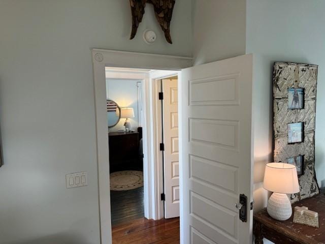 hallway featuring dark hardwood / wood-style flooring