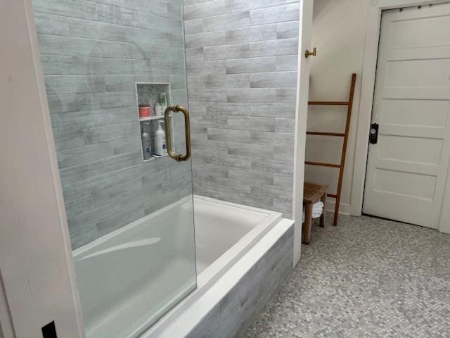 bathroom with a shower with door