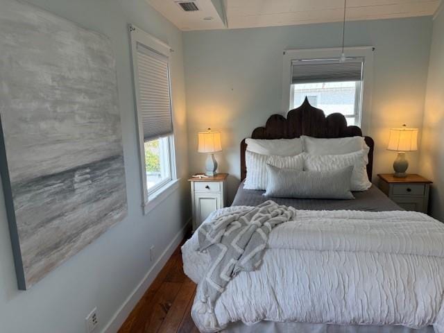 bedroom featuring dark wood-type flooring