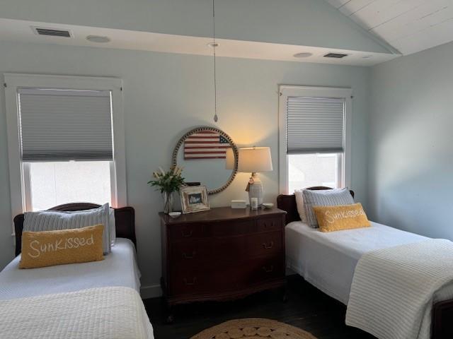 bedroom featuring lofted ceiling