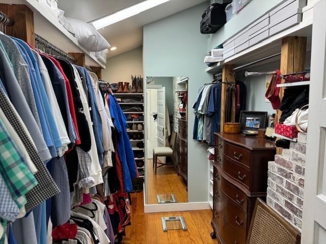 spacious closet with light hardwood / wood-style floors