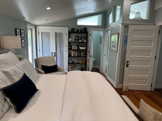 bedroom with vaulted ceiling and wood-type flooring