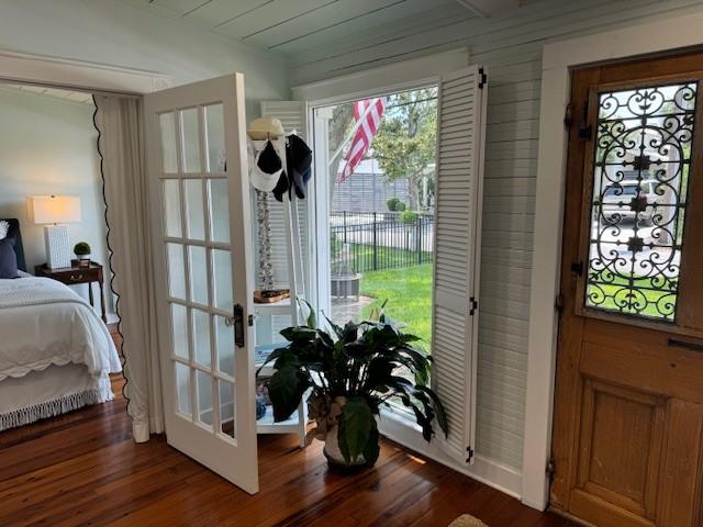 entryway featuring french doors and dark hardwood / wood-style floors