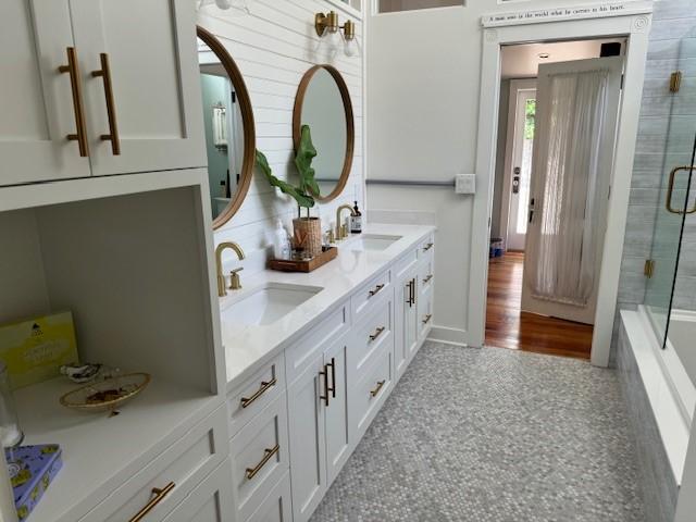 bathroom featuring vanity and shower with separate bathtub