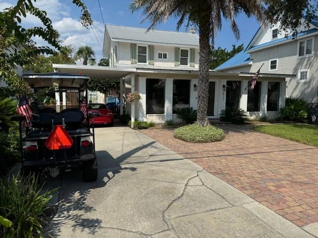 view of front of home featuring a carport