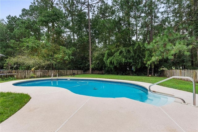 view of pool featuring a yard and a patio area