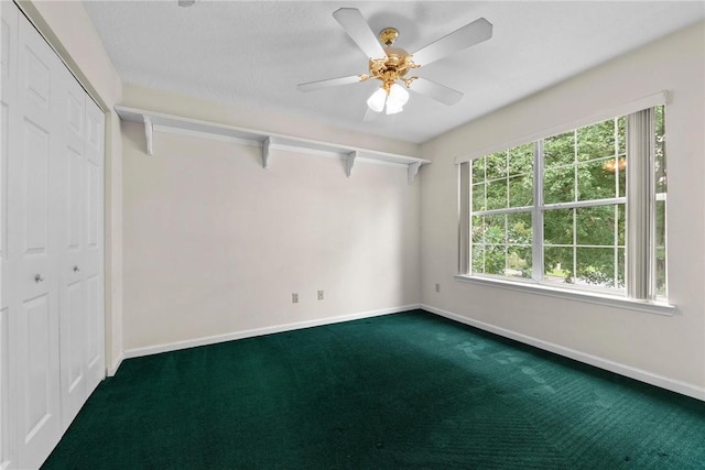 unfurnished bedroom featuring ceiling fan, carpet flooring, and a closet