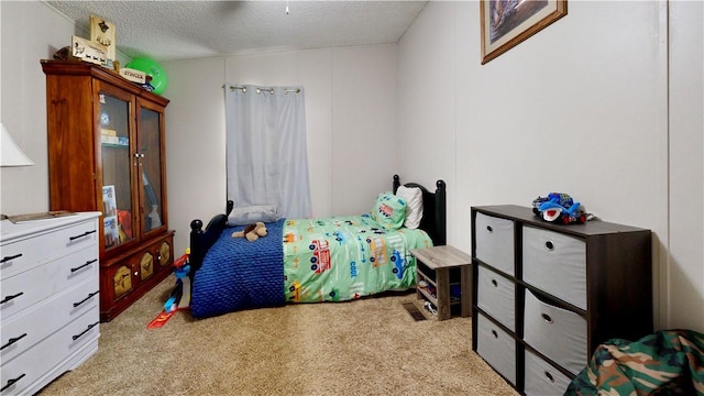 carpeted bedroom with a textured ceiling