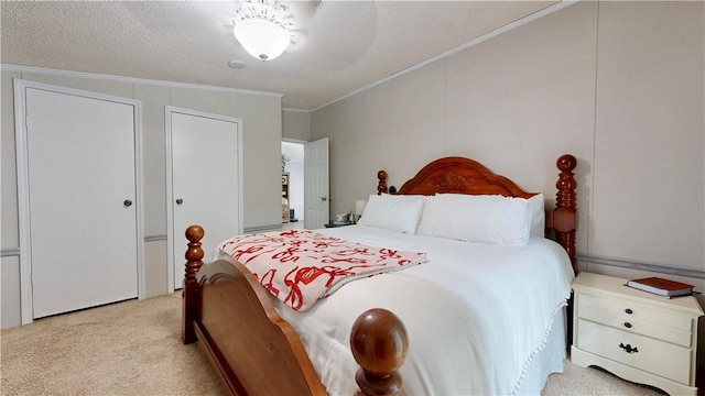 bedroom featuring ornamental molding and light carpet