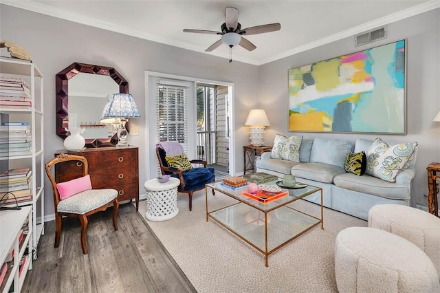 living room with crown molding, hardwood / wood-style flooring, and ceiling fan