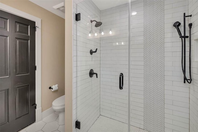 bathroom with walk in shower, tile patterned flooring, and toilet