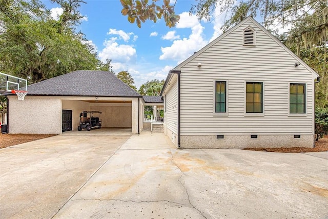 view of side of property featuring a carport