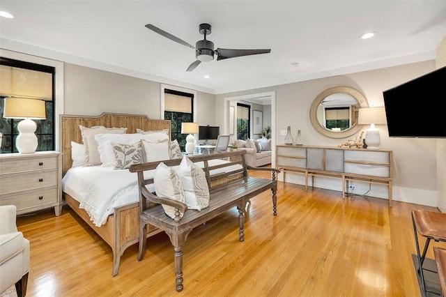 bedroom featuring ceiling fan and light hardwood / wood-style floors