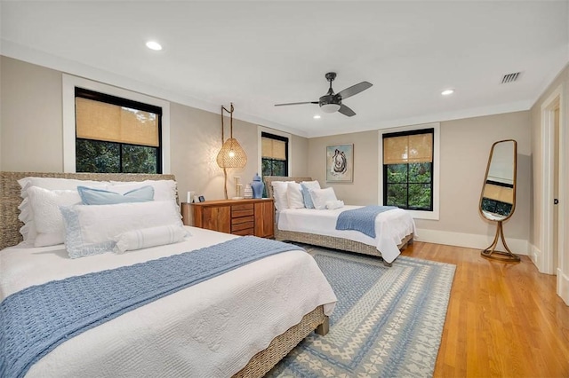 bedroom featuring hardwood / wood-style flooring and ceiling fan