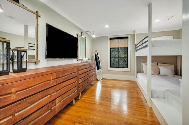 bedroom featuring light hardwood / wood-style floors