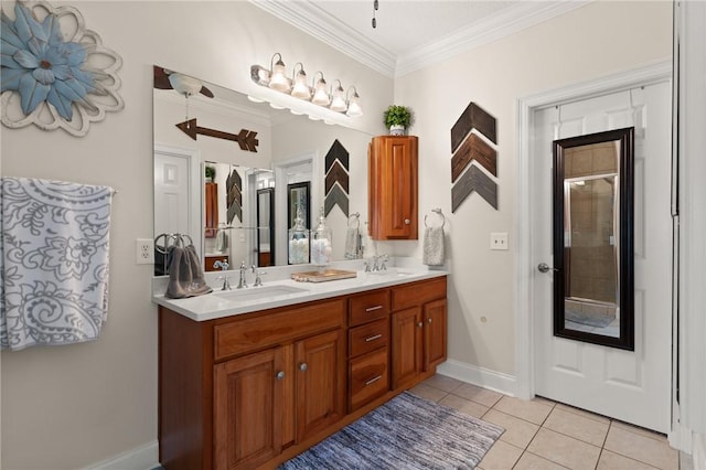 bathroom featuring tile patterned flooring, vanity, and crown molding