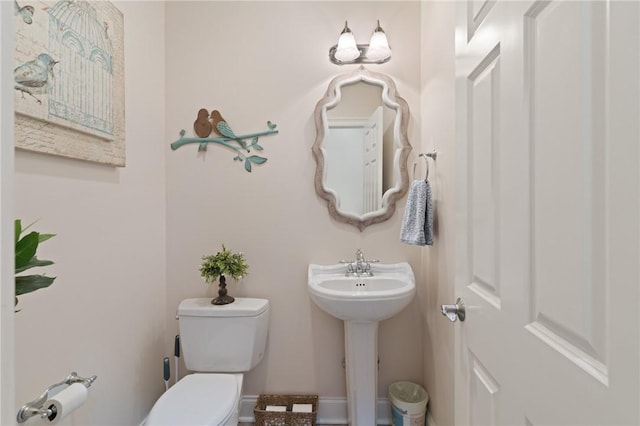 bathroom featuring sink and toilet