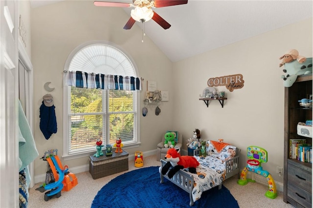 bedroom with vaulted ceiling, carpet floors, and ceiling fan