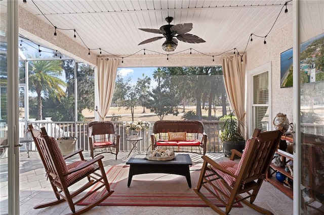 sunroom / solarium with ceiling fan