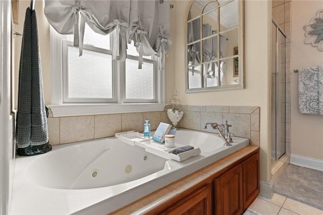 bathroom featuring tile patterned floors and independent shower and bath