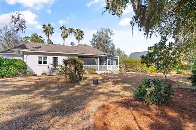 back of property featuring a sunroom