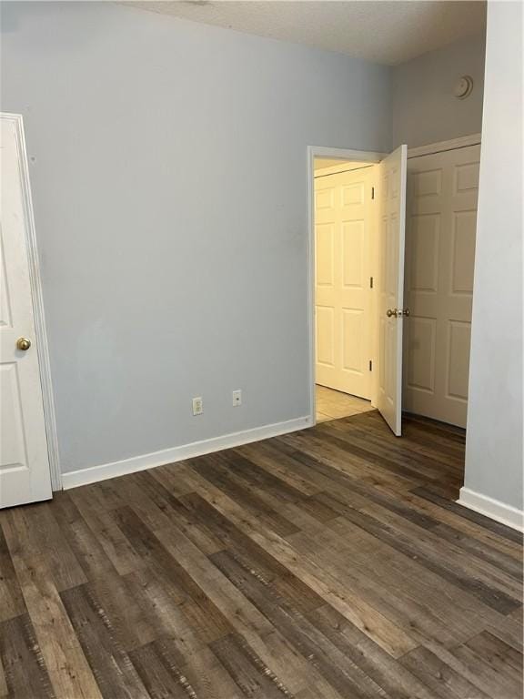 366 Moss Creek Ln, Brunswick, GA 31520 - unfurnished bedroom featuring baseboards and dark wood finished floors