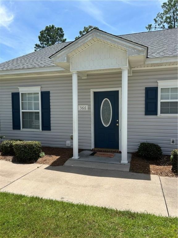 366 Moss Creek Ln, Brunswick, GA 31520 - doorway to property with a shingled roof