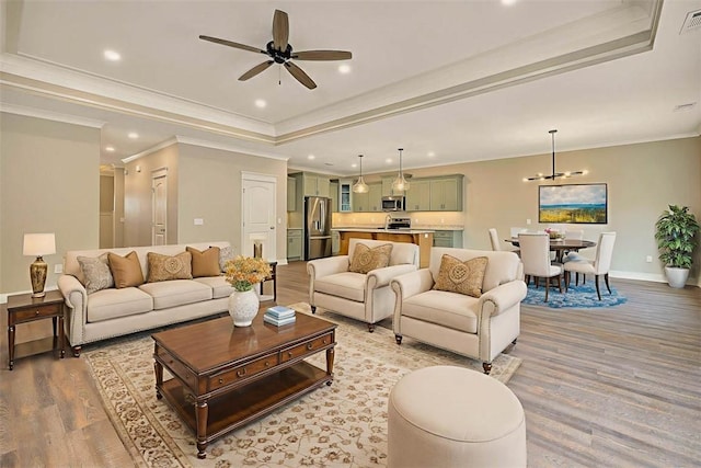 94 Silver Bluff Dr, Brunswick, GA 31523 - living room with a tray ceiling, ceiling fan, light wood-type flooring, ornamental molding, and recessed lighting