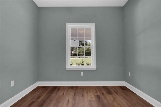 unfurnished room featuring dark hardwood / wood-style flooring