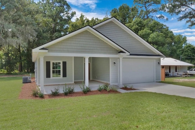 view of front of home featuring central AC, a front lawn, a porch, and a garage