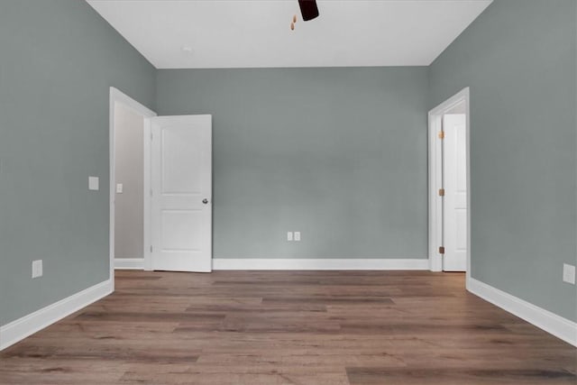 empty room with light wood-type flooring and ceiling fan