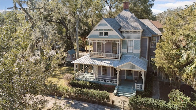 view of front of property with a balcony and covered porch