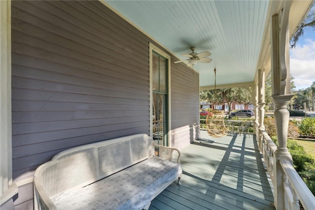 deck with covered porch and ceiling fan