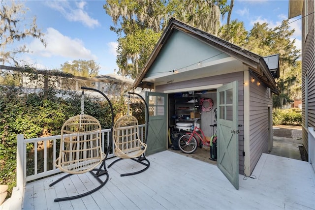 wooden terrace with an outbuilding