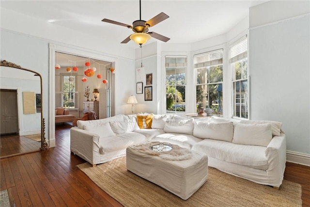 living room with ceiling fan and dark hardwood / wood-style floors