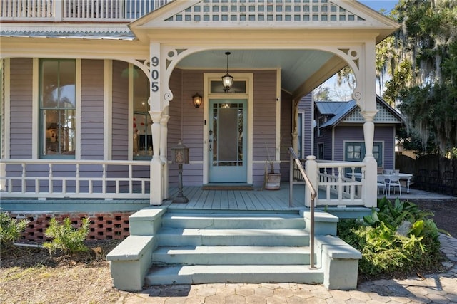 property entrance featuring covered porch