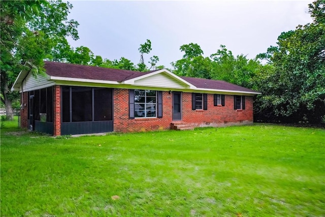 2867 Evergreen Rd, Waycross, GA 31501 - ranch-style house with a front yard, a sunroom, brick siding, entry steps, and crawl space